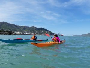 two kayakers in Lyttleton Harbour on a kayak skills course